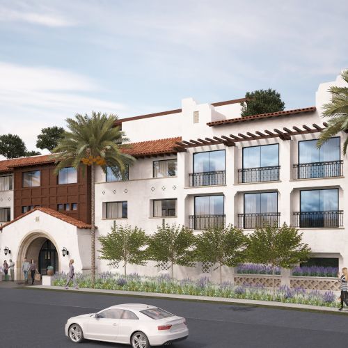 A Mediterranean-style building is shown with balconies, palm trees, and parked cars along the street. People are walking near the entrance.