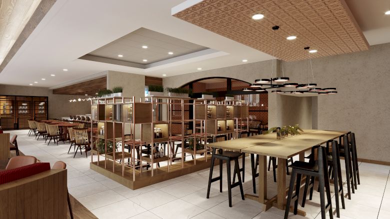 The image displays a modern restaurant interior with wooden tables, chairs, partitioned areas, and contemporary lighting, creating a cozy atmosphere.